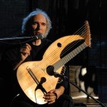 John Doan in concert, telling stories from the stage at the Folk Life Festival