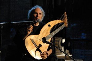 John Doan in concert, telling stories from the stage at the Folk Life Festival