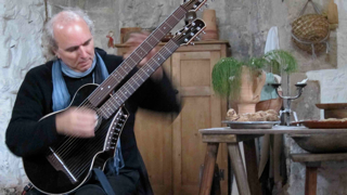 john doan playing harp guitar in England.